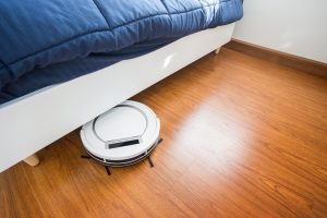 robot vacuum working on wooden floors