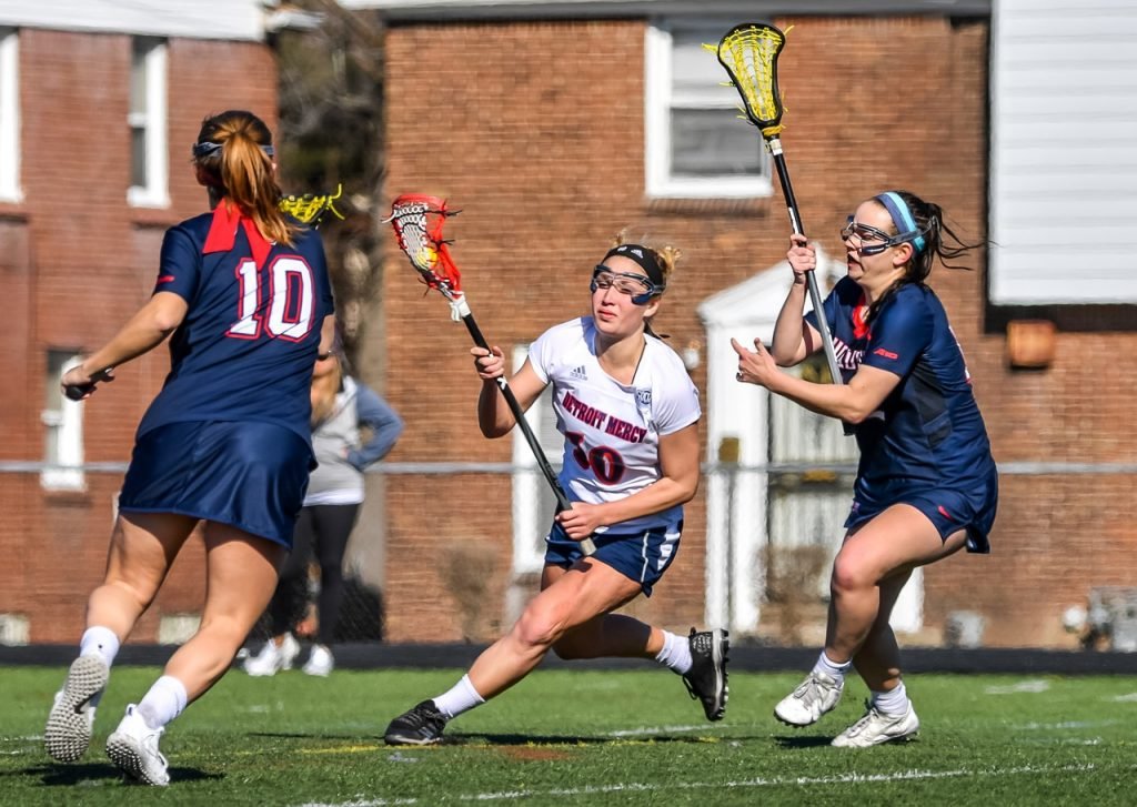 women lacrosse game in the field